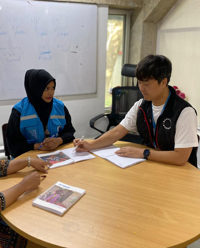 Two people sitting at a table.